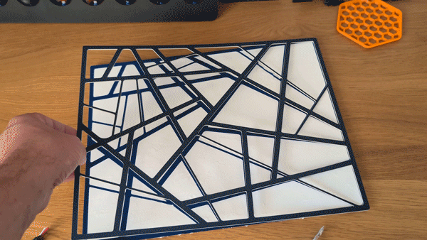 Animation of two versions of the map outline; one vinyl sticker, one mount board